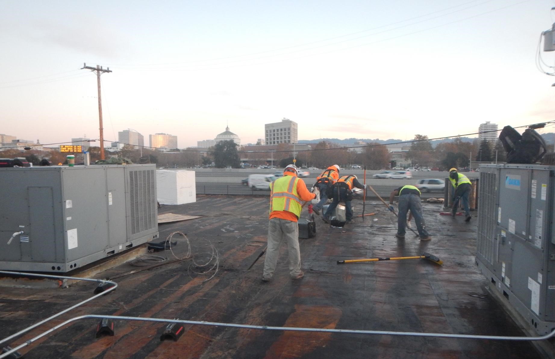PSM Associates team working on a reroofing project