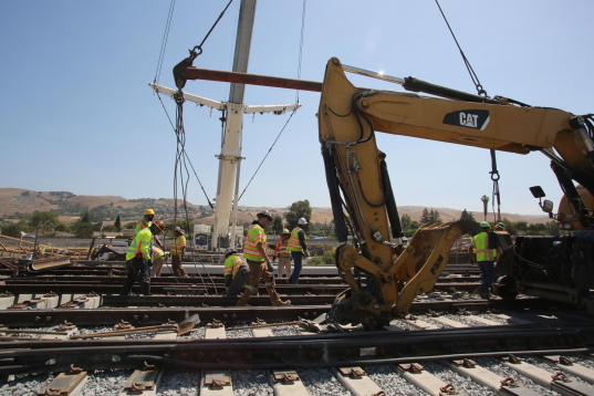 PSM Associates crew working on railroad tracks